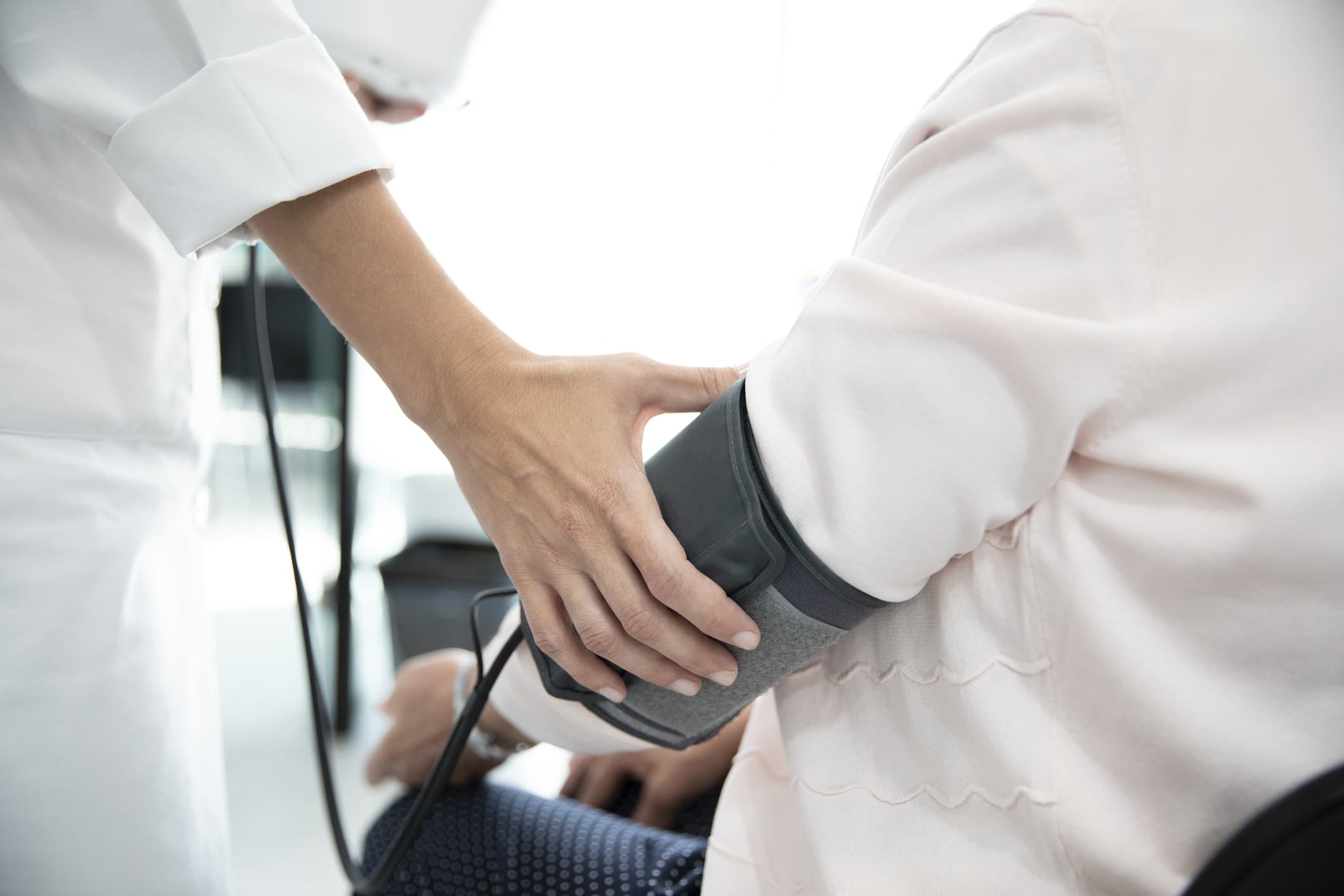 Measuring the pressure of senior woman